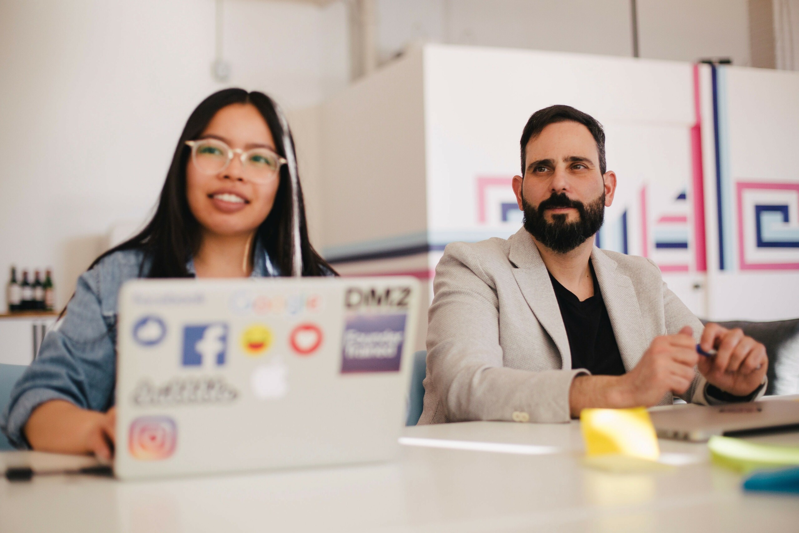 two digital agency London experts working on laptop